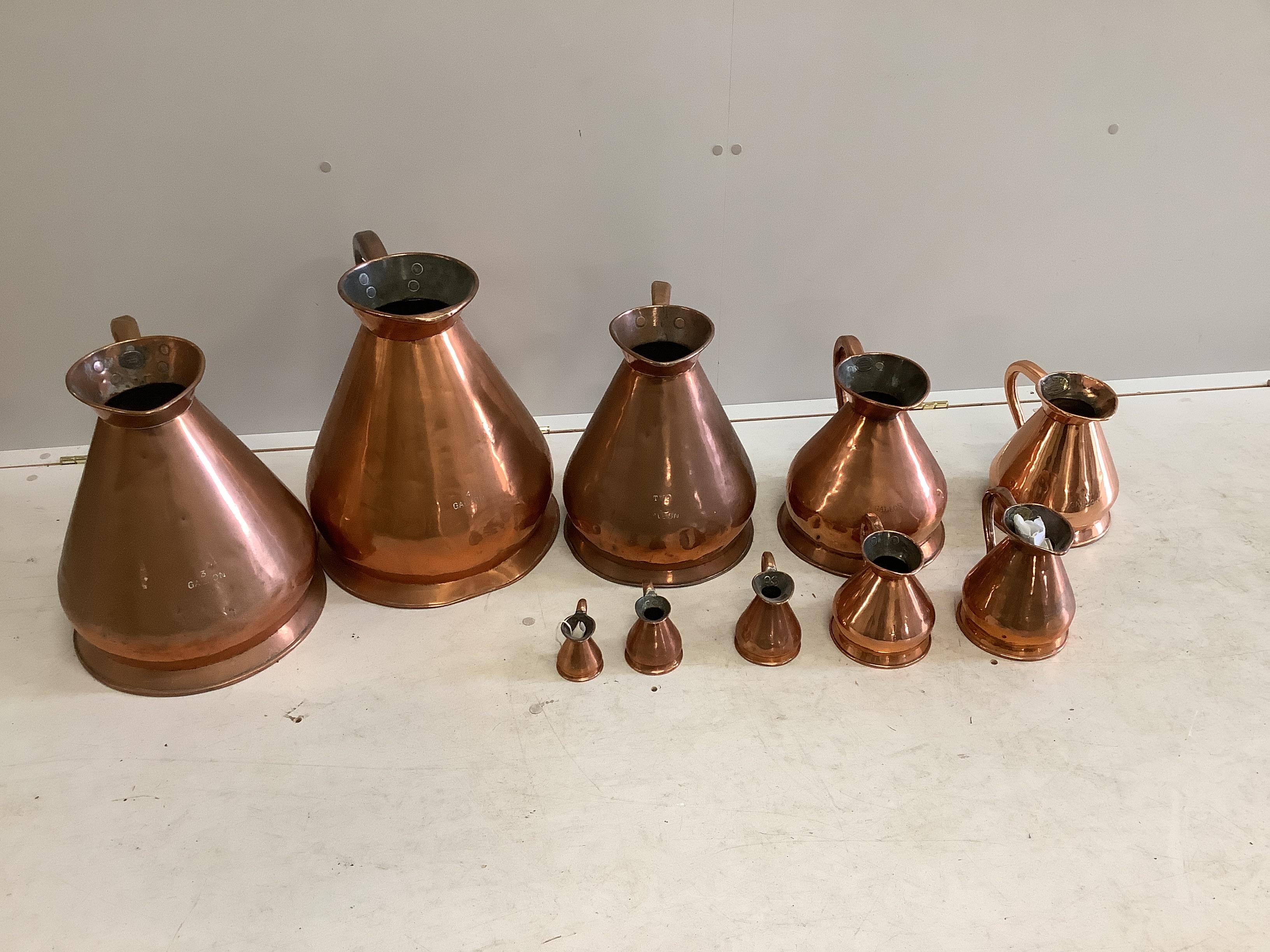 A matched graduated set of ten late 19th / early 20th century copper haystack measures, four gallons to a half gill, largest height 41cm